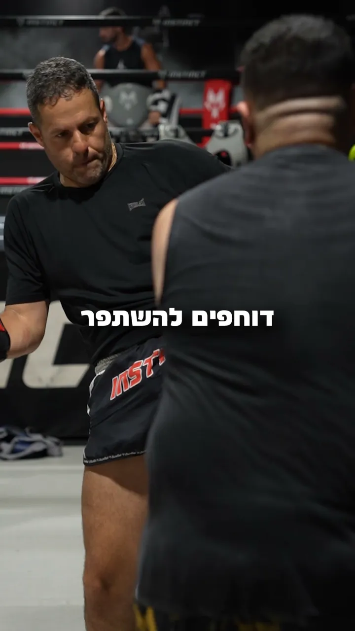 Muay Thai pad training session inside Instinct Gym